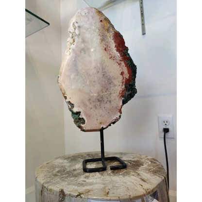 Pink amethyst polished slab sculpture with translucent white interior and red green mineral streaks on metal stand 3.11kg