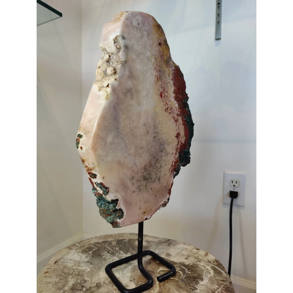 Pink amethyst polished slab sculpture with creamy white interior and red green brown mineral veins on metal stand 3.11kg