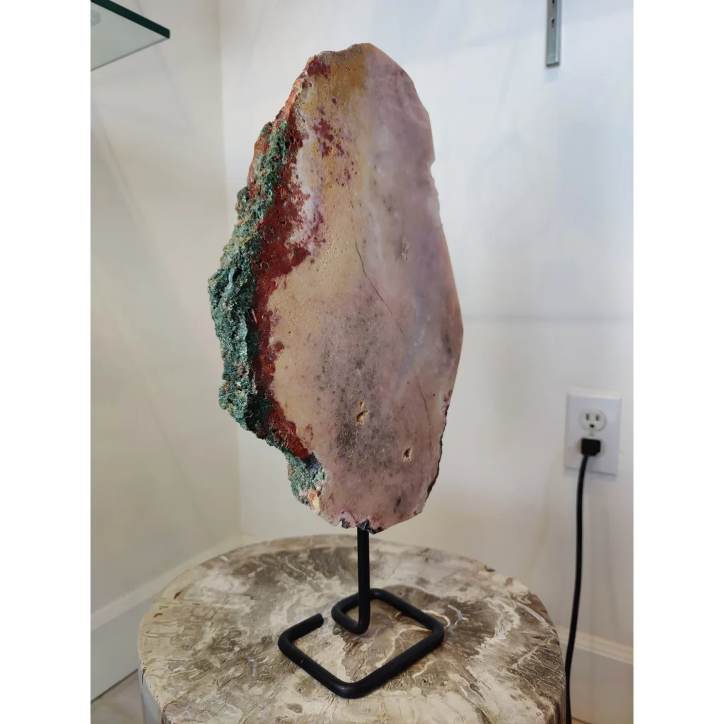 Striking pink amethyst polished slab sculpture with purple interior and green red veins on metal display stand 3.11kg