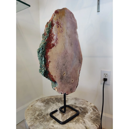 Striking pink amethyst polished slab sculpture with purple interior and green red veins on metal display stand 3.11kg