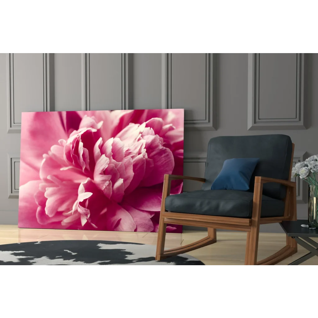 Vibrant pink peony wall art canvas print with glossy petals on gray wall