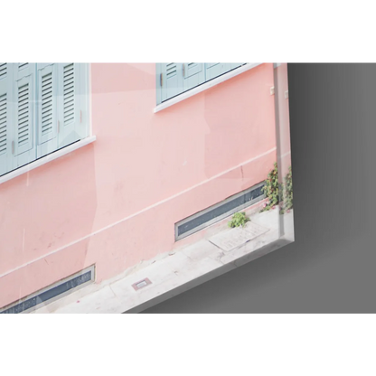 Pink stucco facade with pastel blue shutters wall art canvas print