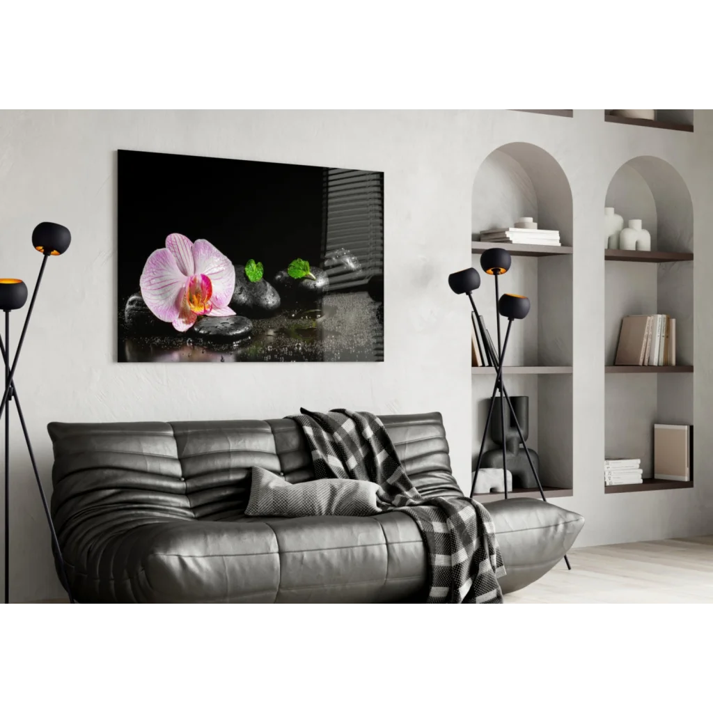 Pink orchid zen garden wall art on black stones with yellow center