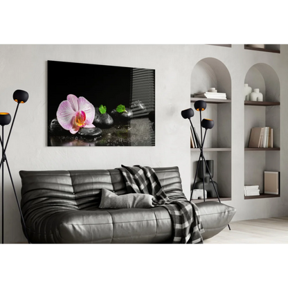 Pink orchid zen garden wall art on black stones with yellow center