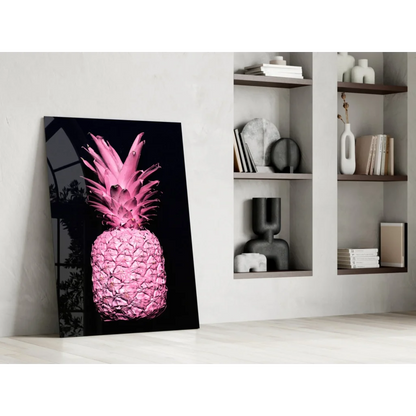 Vibrant pink pineapple glass wall art on black canvas against white wall