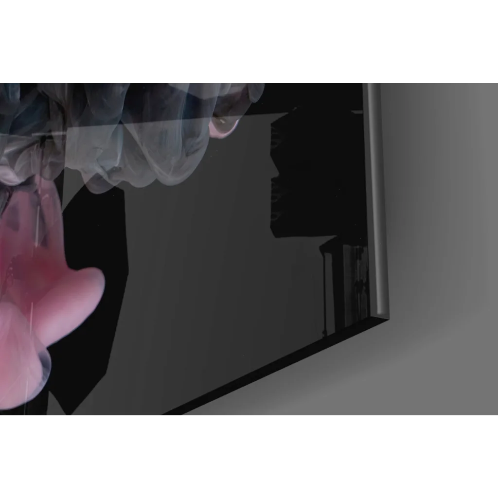 Glossy black TV with silver trim on pink swirl glass wall art