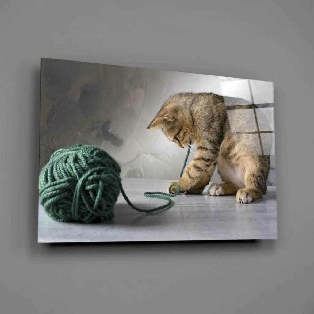 Playful tabby kitten with yarn ball canvas wall art print