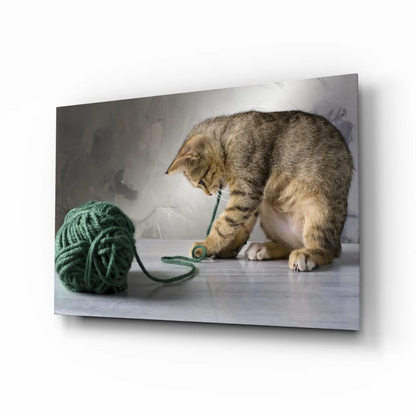 Playful tabby kitten with yarn ball canvas wall art print
