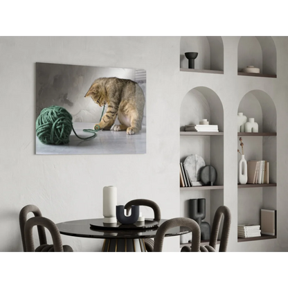 Playful tabby kitten with yarn ball canvas wall art