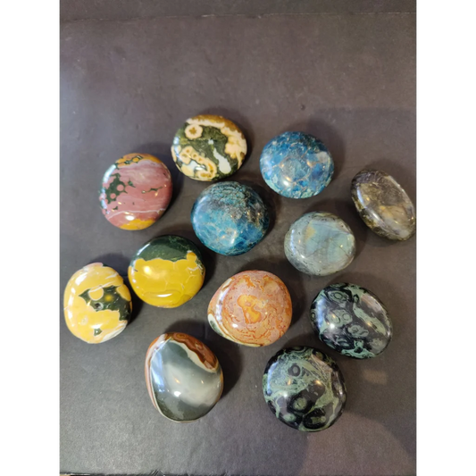 Polished palmstone assorted jasper stones in vibrant oval shapes with natural colorful patterns and smooth finish
