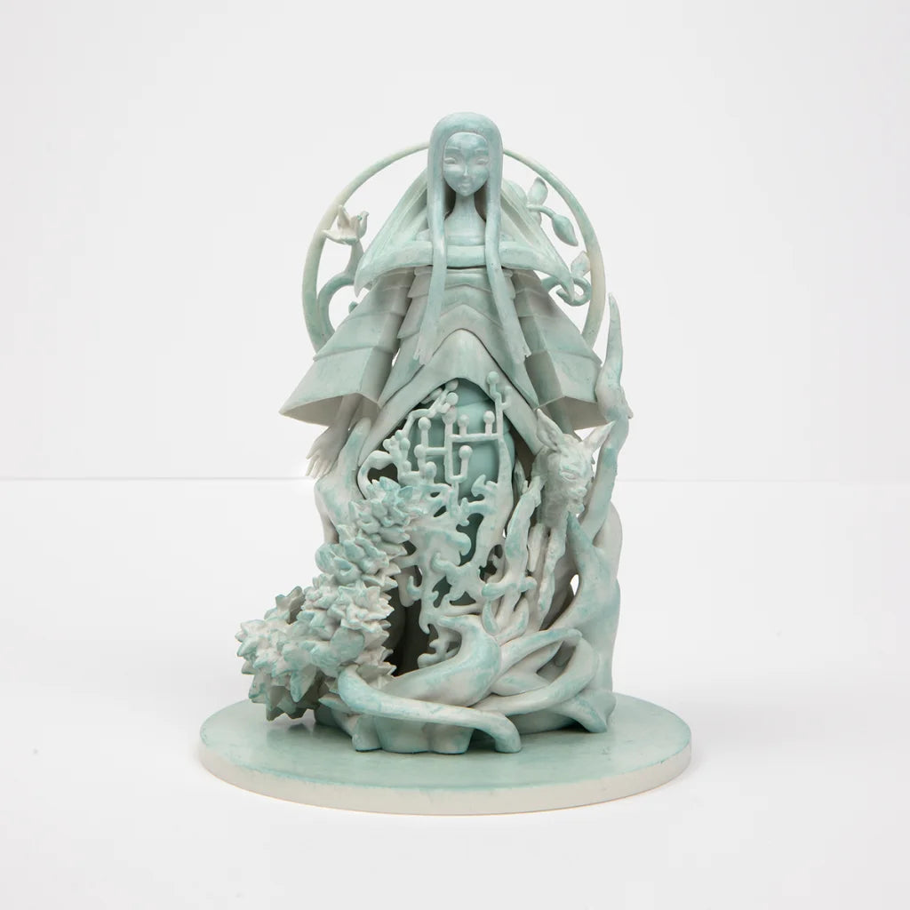 Light teal-green Poppy Altar statue with intricate patterns and decorative halo