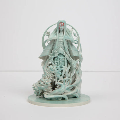 Mint green Poppy Altar statue of cloaked figure with red mask and organic details