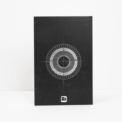 Black book with white spirograph design from Poppy’s Inferno Deluxe Graphic Novel