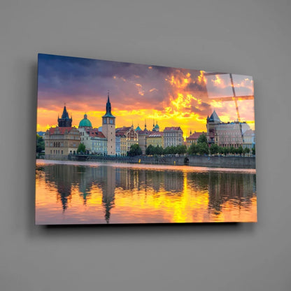Vibrant golden sunset cityscape glass wall art with European architecture