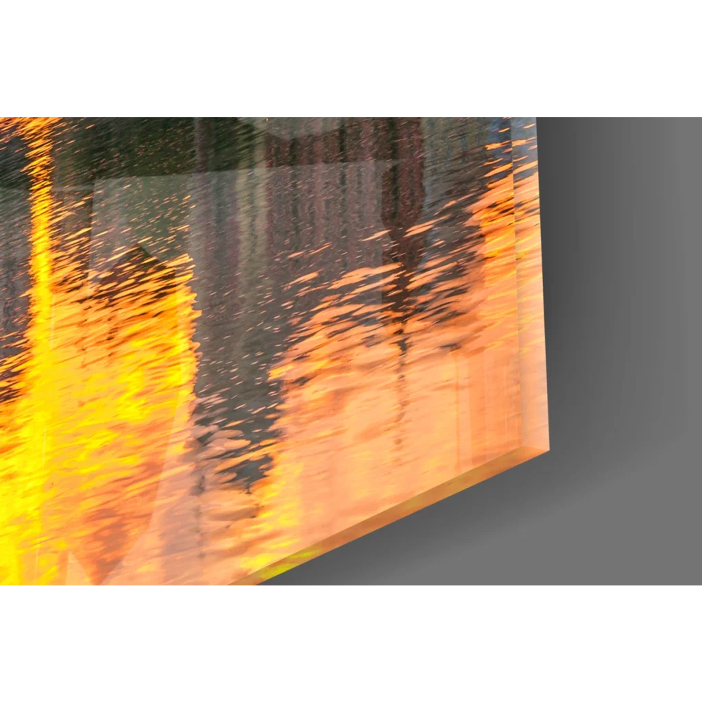 Golden sunset cityscape glass wall art with vibrant orange yellow abstract reflective textures on acrylic panel