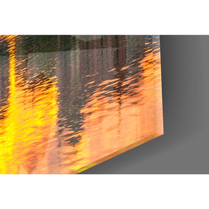 Golden sunset cityscape glass wall art with vibrant orange yellow abstract reflective textures on acrylic panel