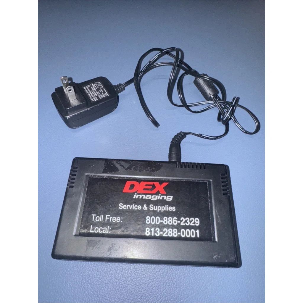 Black DEX Imaging power adapter with coiled cord for Emerge Print Counter