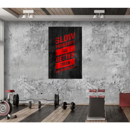 Black canvas motivational wall art with bold red text slow progress is better than no progress on distressed concrete wall