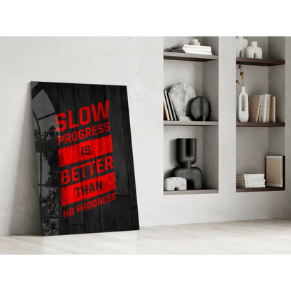 Bold red text Slow Progress is Better Than No Progress on black canvas wall art