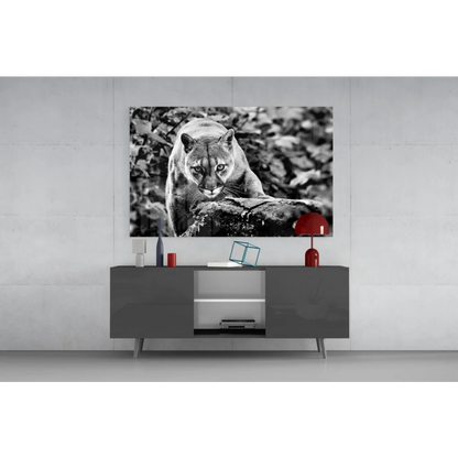 Black-and-white cougar on tree branch glass wall art