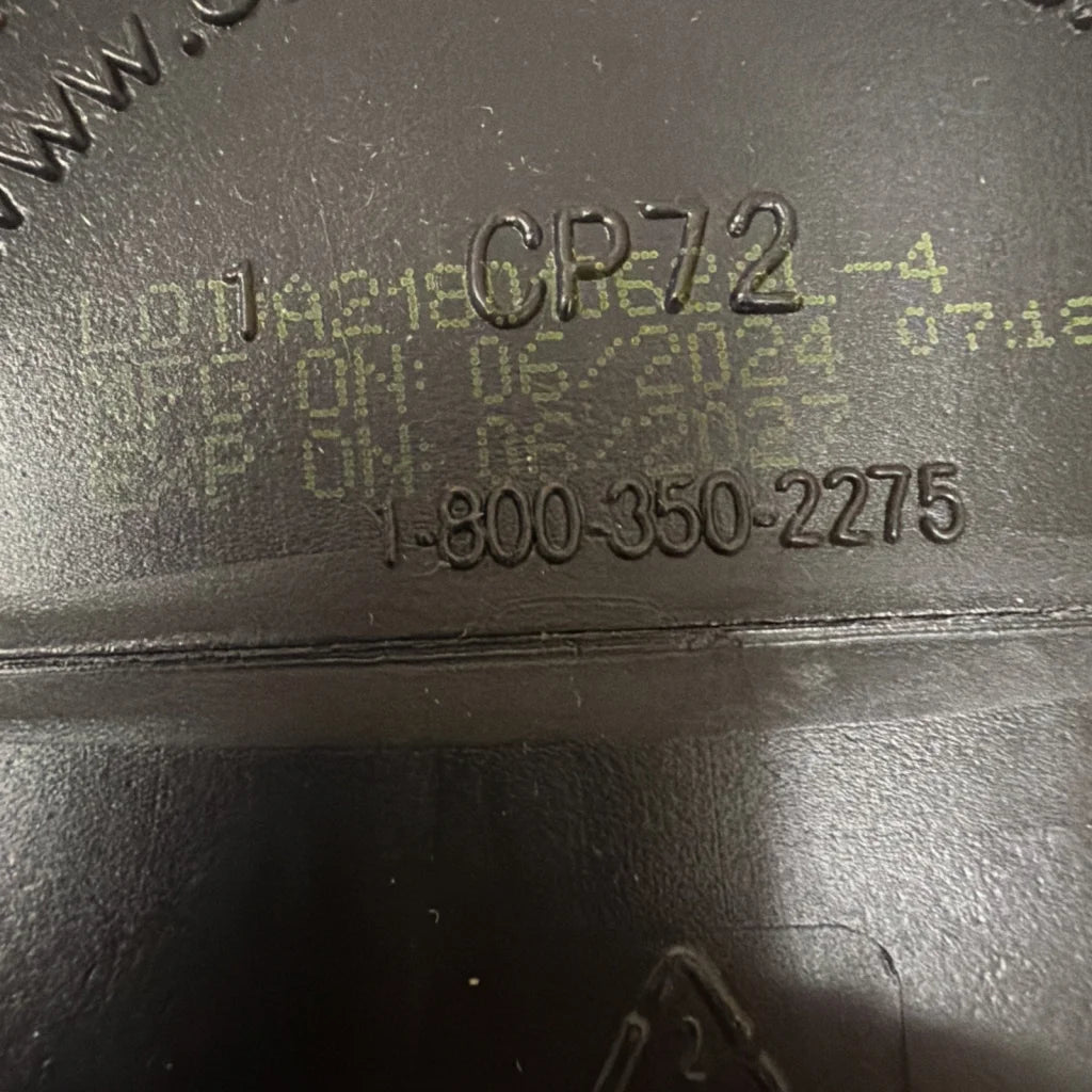 Back of Pump Fuel Ultra Insanity Glyco Load Cherry Bombsicle with phone number on black rubberized surface, exp 06/27