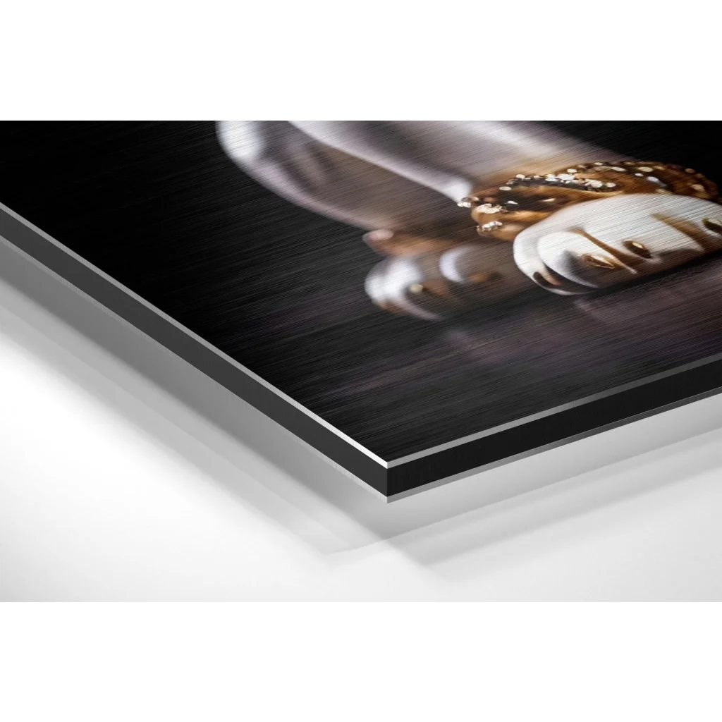 Close-up of clasped white and gold hands on brushed aluminium dibond print