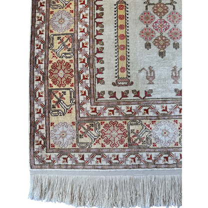 Vintage Kayseri silk rug from Turkey, close-up of geometric and floral motifs in warm natural tones