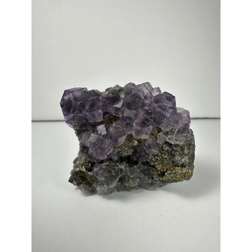 Purple dodecahedral fluorite crystal cluster from China