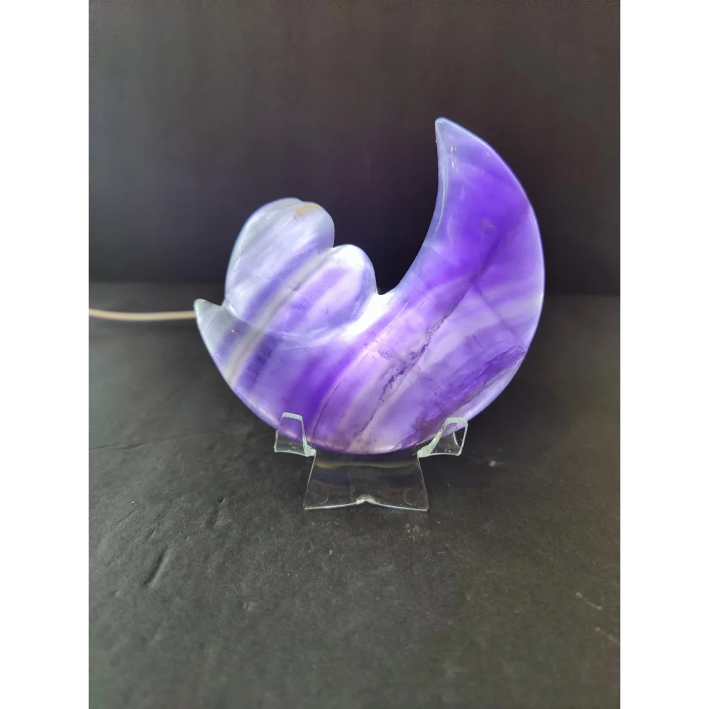 Purple fluorite half-moon and heart sculpture with translucent purple and white stripes on a 5 inch metal stand