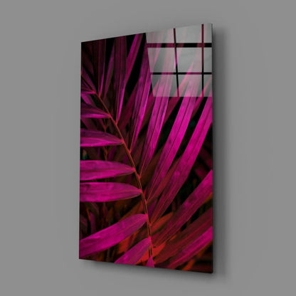 Vibrant magenta palm glass wall art on sleek acrylic panel