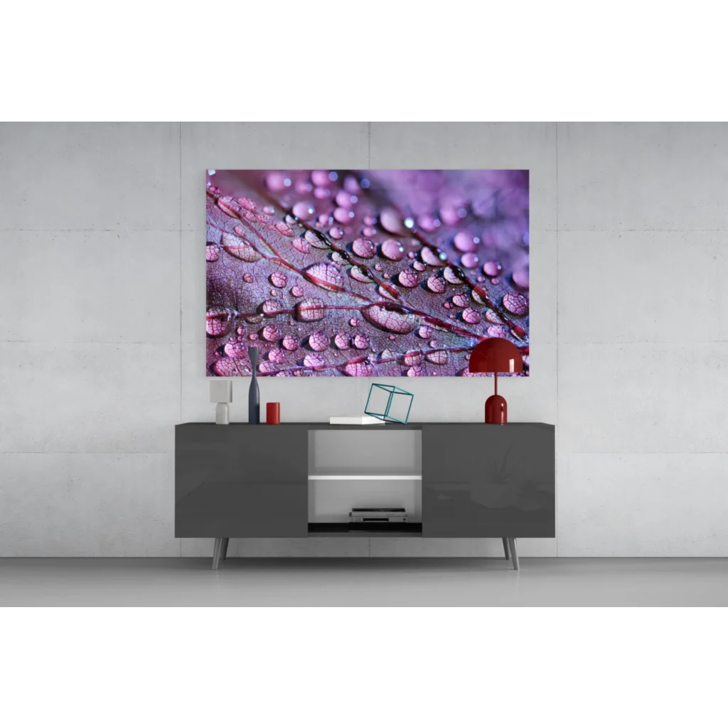 Vibrant purple and pink water droplet glass wall art on gray console
