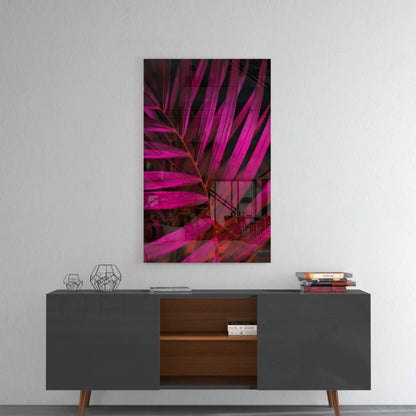 Vibrant magenta palm glass wall art on gray console table
