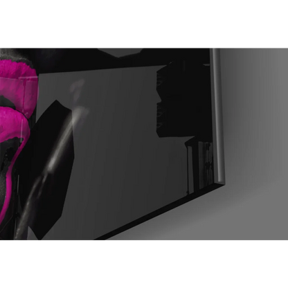 Sleek black smartphone with pink drip accent in wall art