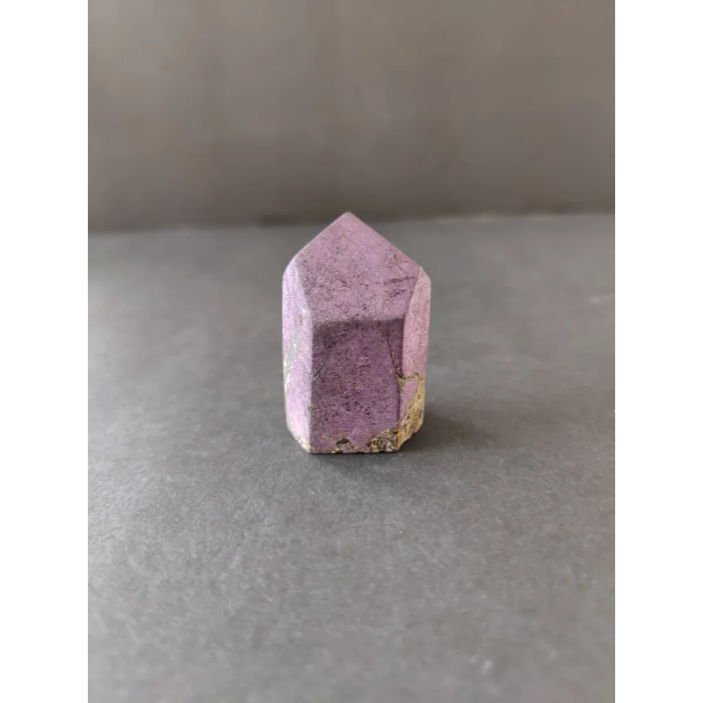 Purpurite Lapidary: faceted purple crystal with gold-tipped base