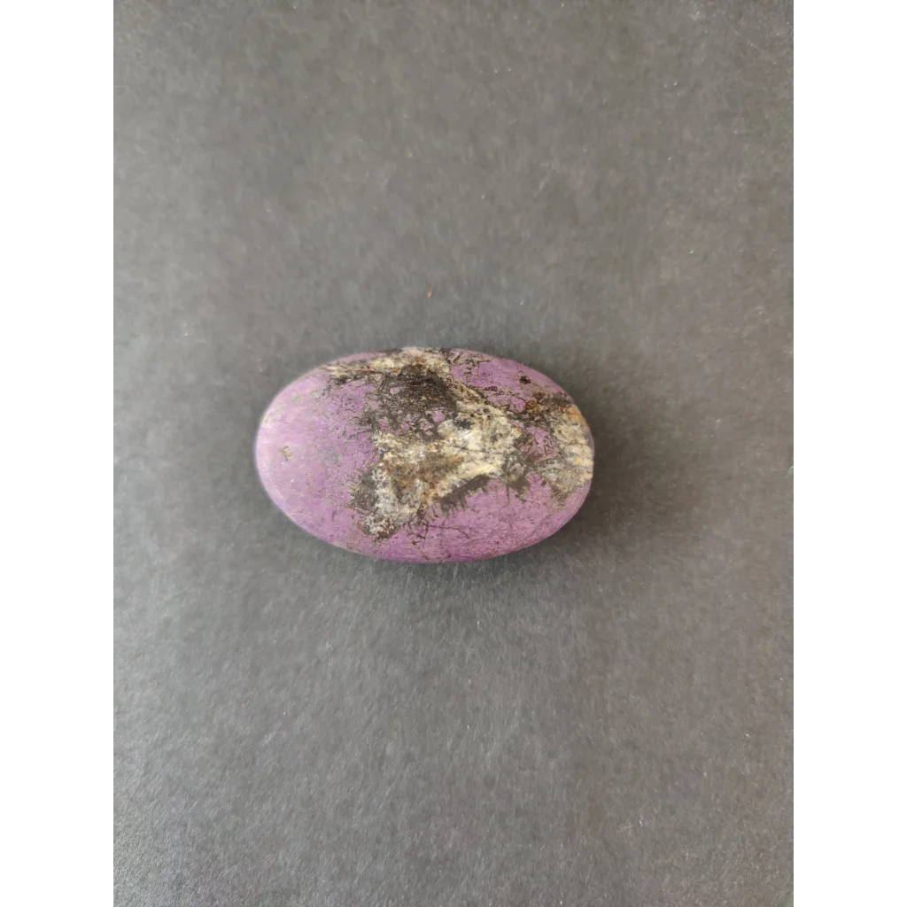 Smooth oval purple Purpurite Lapidary gemstone with brown white inclusions