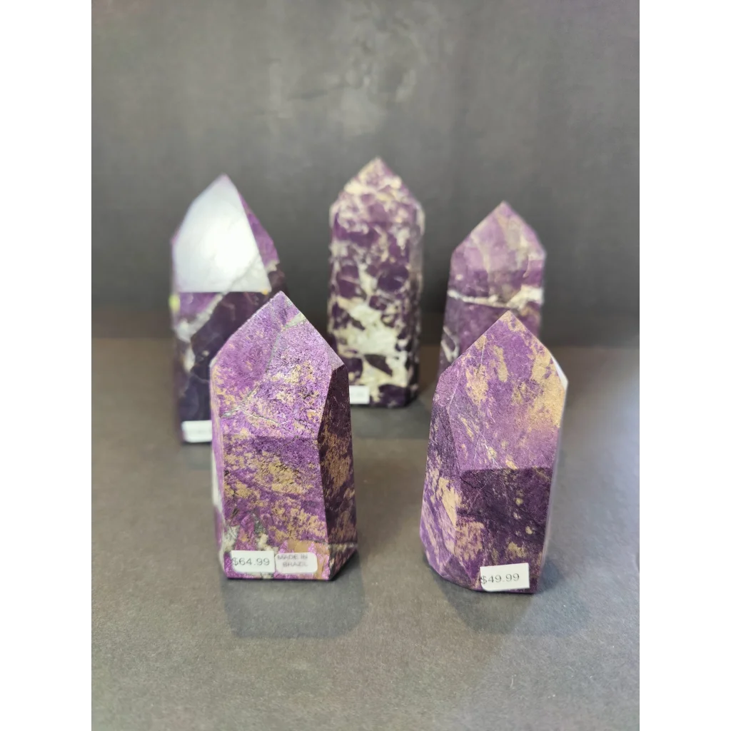 Purpurite polished obelisk tower sculpture with purple and gold-speckled polished faceted crystal point pillars