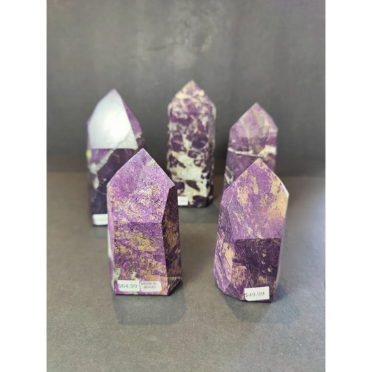 Purpurite polished obelisk tower sculpture with purple and gold-speckled polished faceted crystal point pillars