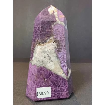 Purpurite polished obelisk tower sculpture featuring a purple amethyst geode with white crystals and golden veins