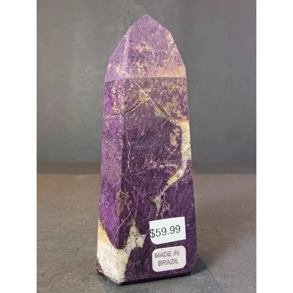 Purpurite polished obelisk tower sculpture featuring purple white mineral with golden streaks shaped into a tall pointed obelisk