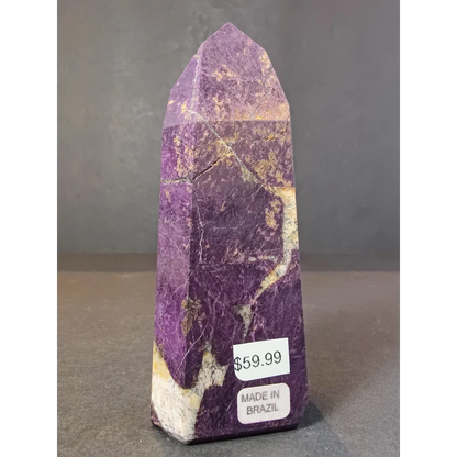 Purpurite polished obelisk tower sculpture featuring purple white mineral with golden streaks shaped into a tall pointed obelisk