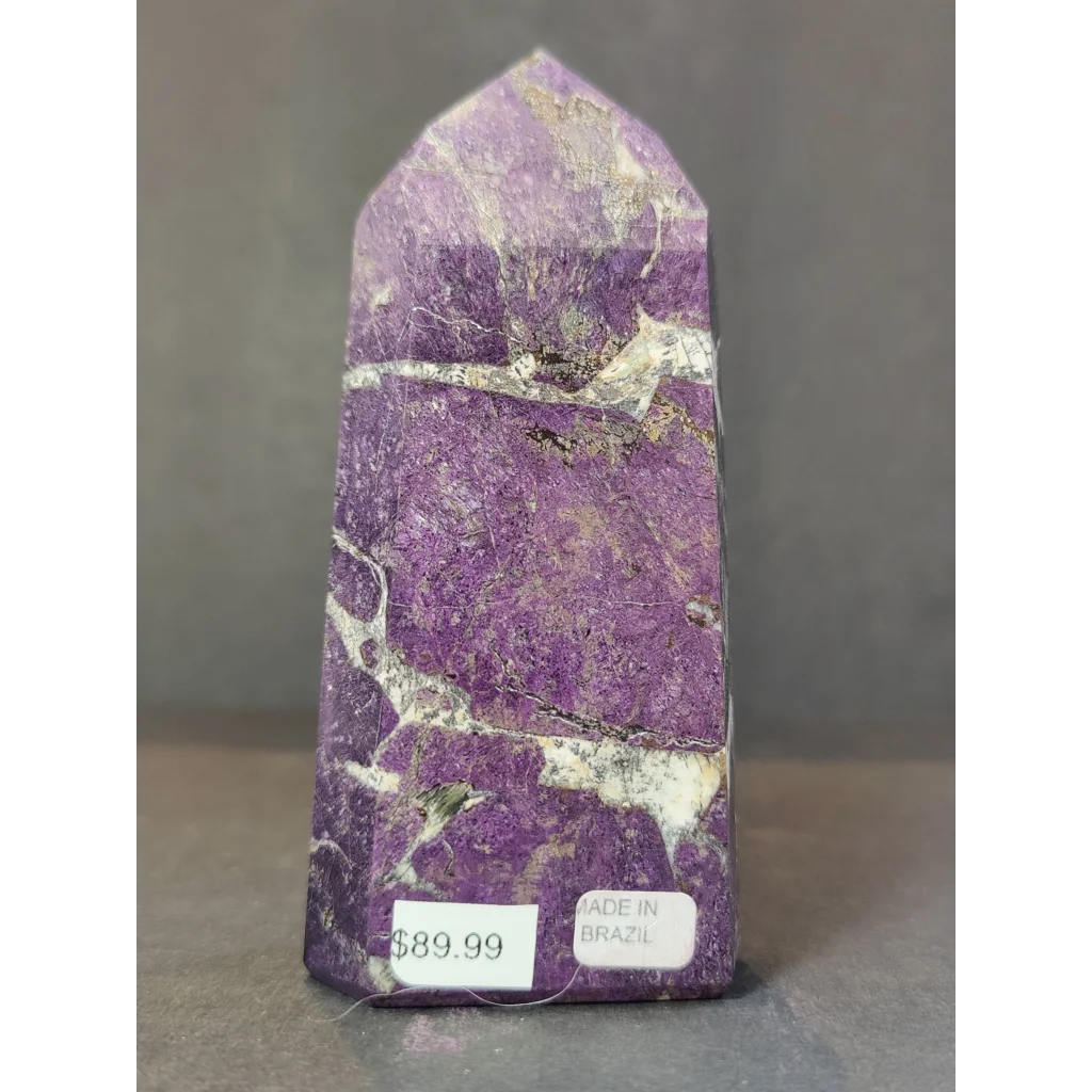 Purpurite polished obelisk tower sculpture featuring a purple and white veined amethyst crystal point with a pointed top
