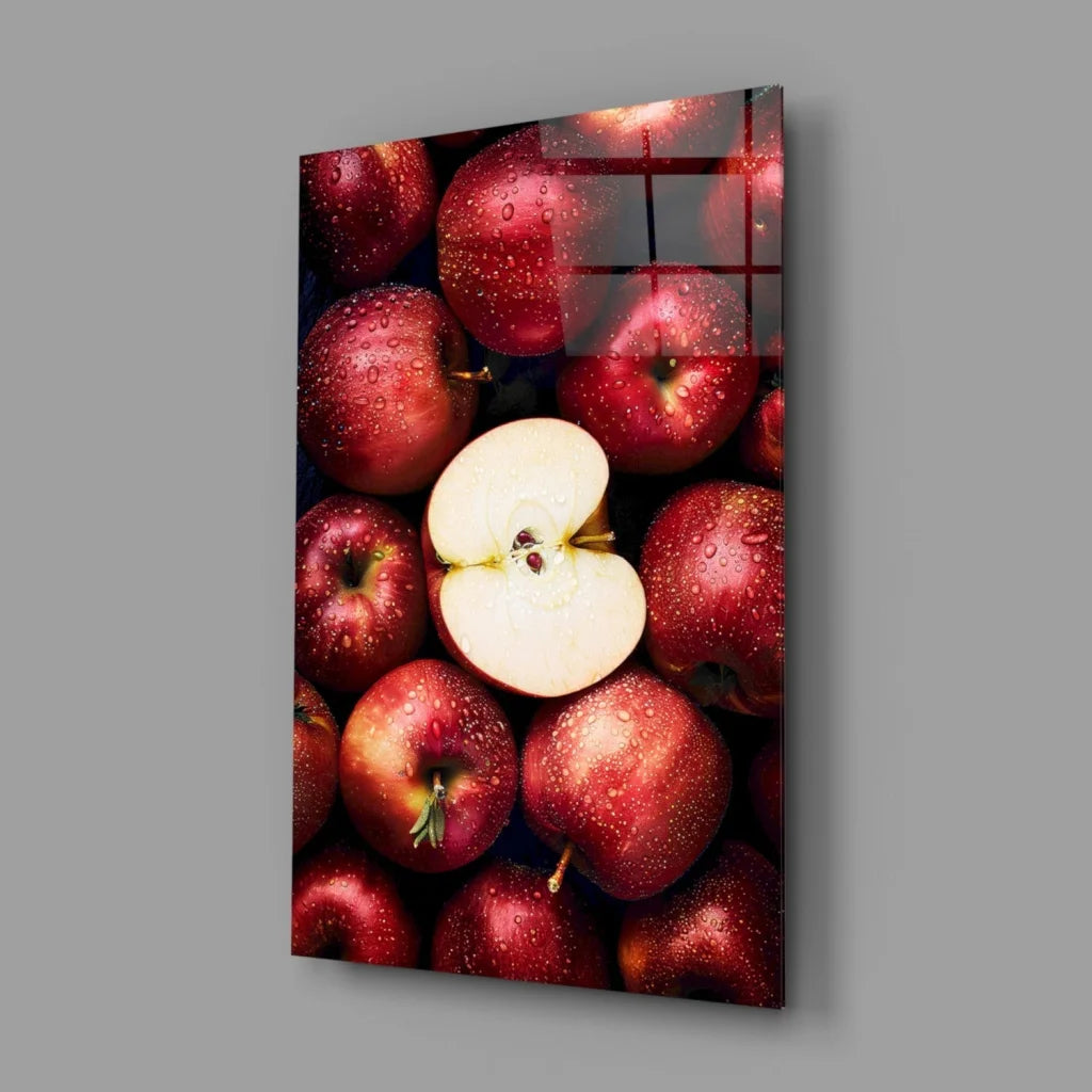 Vibrant juicy red apple glass wall art with sliced apple on glossy panel