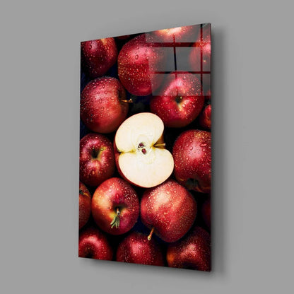 Vibrant juicy red apple glass wall art with sliced apple on glossy panel