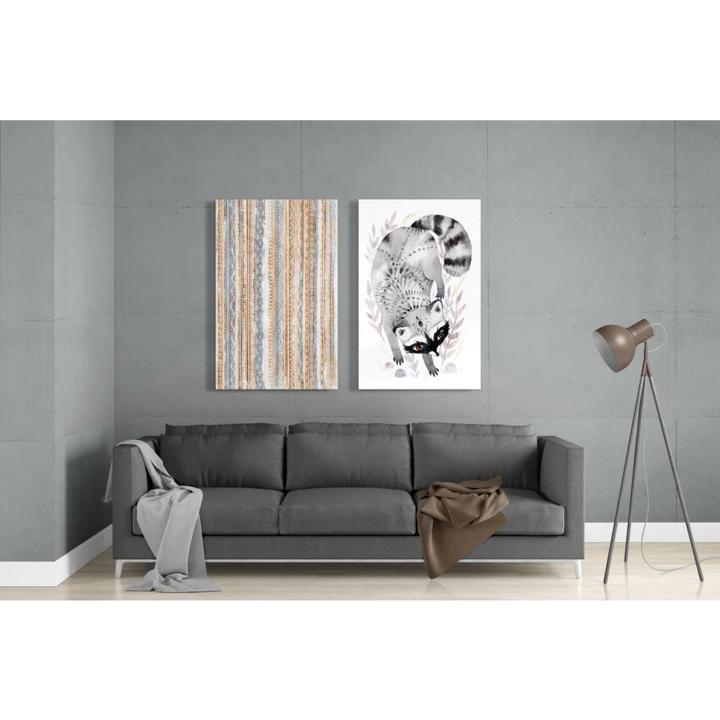 Gray upholstered sofa with white legs and raccoon glass wall art