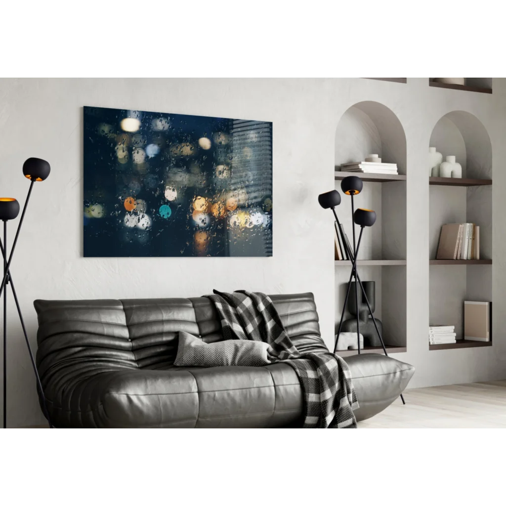 Dark gray tufted leather sofa with plaid throw and Raindrop City Lights glass wall art