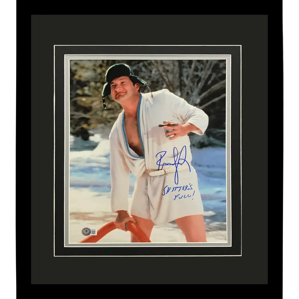 Signed Randy Quaid Cousin Eddie deluxe framed 11x14 photo in white robe with hose on snow