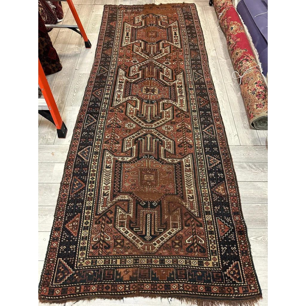 1875 Caucasian Kazak Sewan wool runner, border detail with geometric motifs, antique aged patina