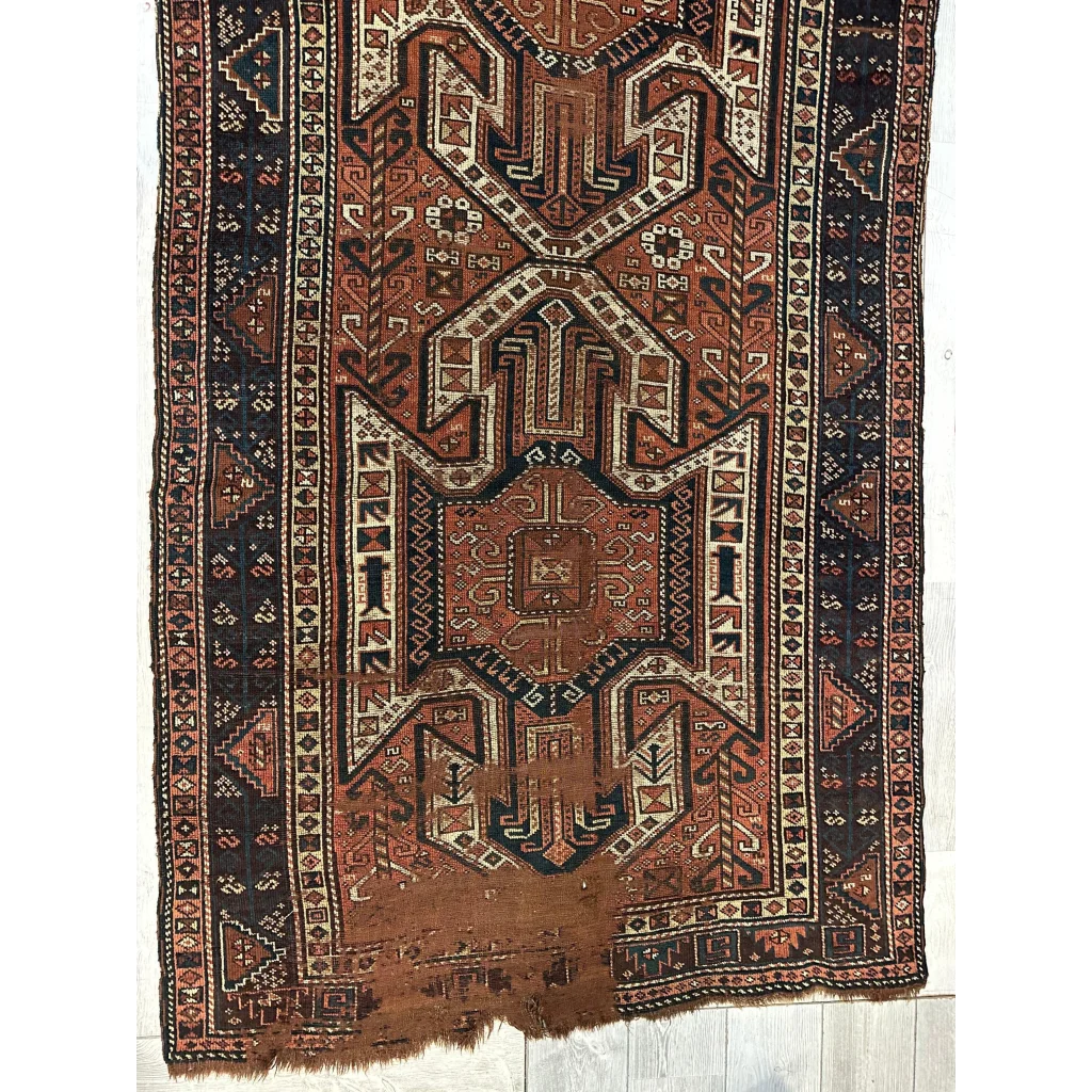 Rare 1875 Kazak runner Caucasian, field pattern close-up in red geometric design, all-wool construction