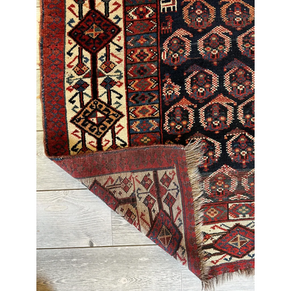 Rare 1880s Persian Afshar rug with intricate geometric medallion patterns in reds, blues, cream