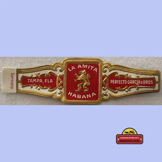 Ornate cigar band of Antique Vintage La Amita Habana with golden lion emblem